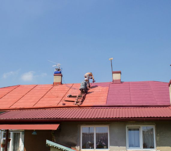 Two Men Painting Roof